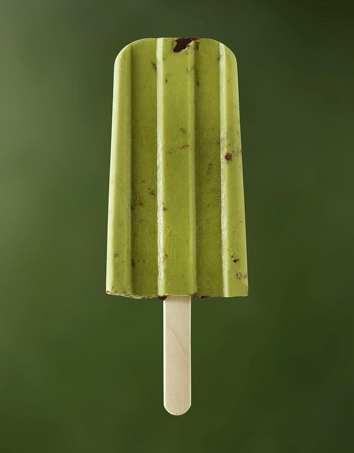 Cashew Matcha Ice Cream On Sticks On A Green Background #1 Photograph by Michael Lffler