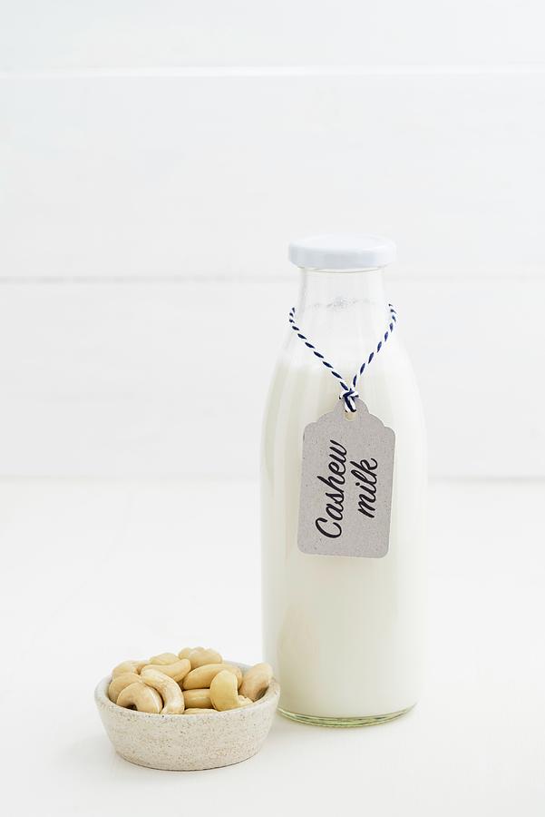 Cashew Nut Milk In A Glass Bottle #1 Photograph by Elisabeth Clfen