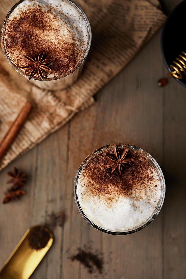 Chai Latte In Glasses With Milk Foam, Cinnamon And Anise Stars #1 Photograph by Natasa Dangubic