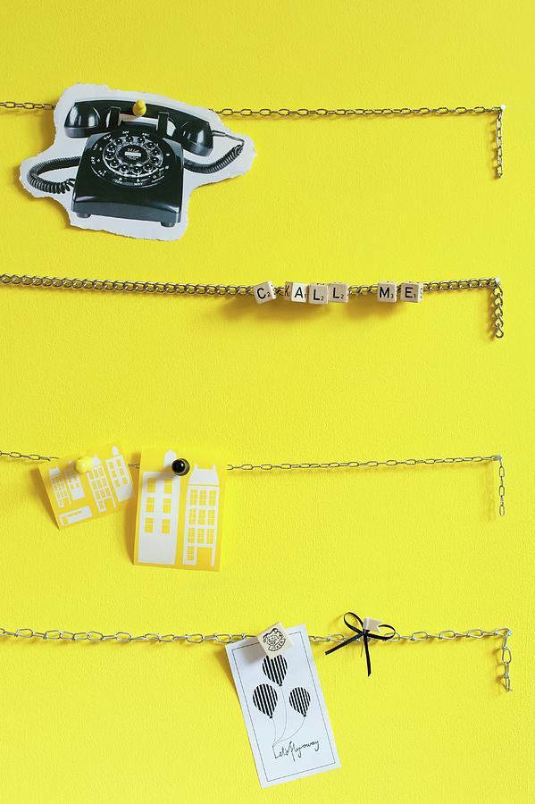 Chains Used As Pinboard On Yellow Wall #1 Photograph by Studio27neun