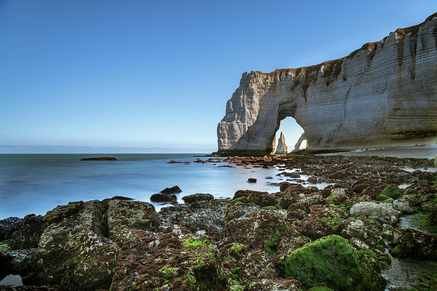 Chalk cliffs of Etretat with the natural arch called Manneporte the ...