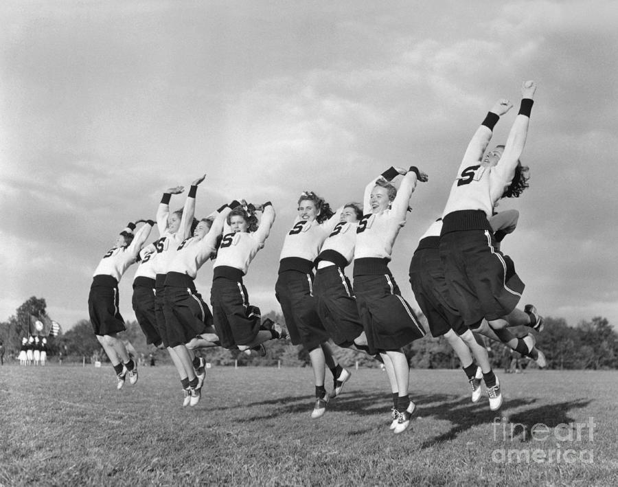 Cheerleaders Jumping In The Air #1 Photograph by Bettmann