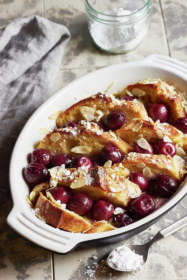 Cherry Ofenschlupfer bread Pudding With Almonds #1 Photograph by Ulrike Emmert