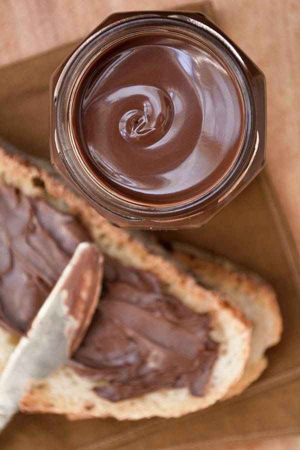 Chocolate Spread In A Jar And On Bread #1 Photograph by Marya Cerrone
