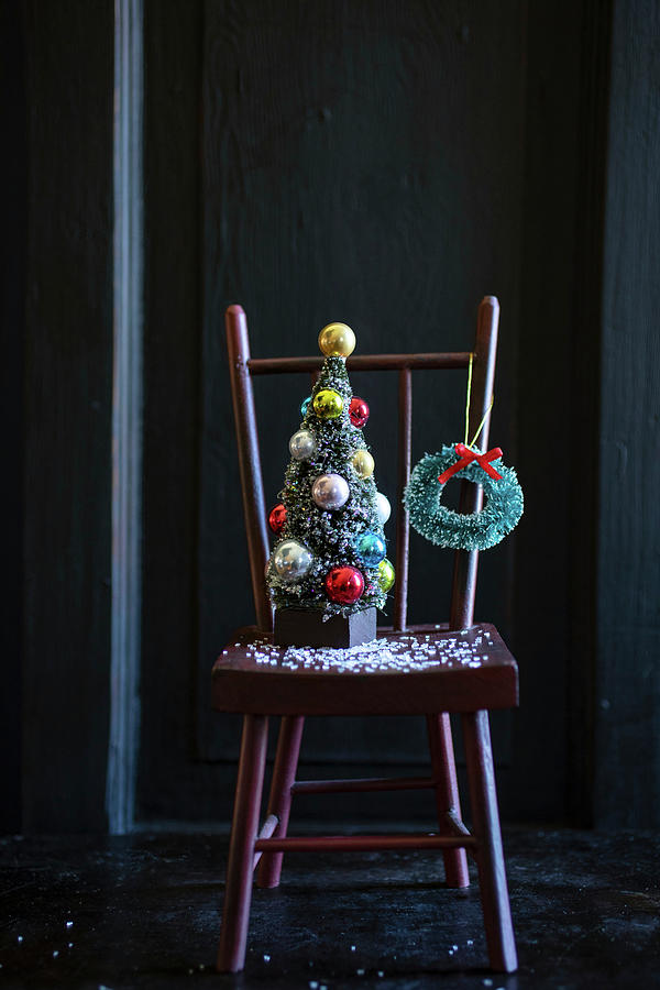 Christmas Decoration On Wooden Chair #1 Photograph by Eising Studio