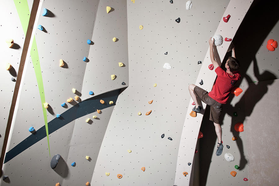 Climber Bouldering At Indoor Climbing Wall In London Photograph By Cavan Images Fine Art America