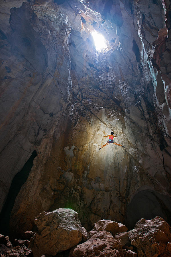 Rope Photograph - Climber Climbing Out Of The Windy Cave At Crazy Horse Buttress #1 by Cavan Images