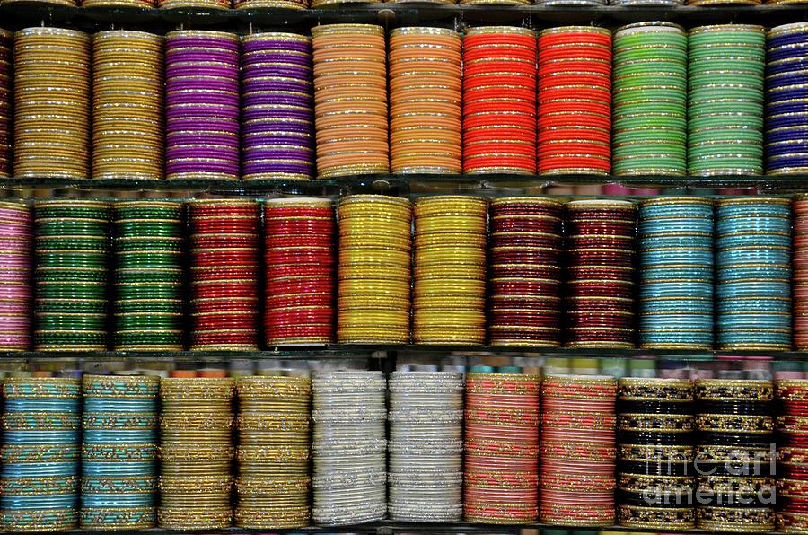 Colorful glass and metal bangles on display at shop shelf Clifton Karachi Pakistan #1 Photograph by Imran Ahmed