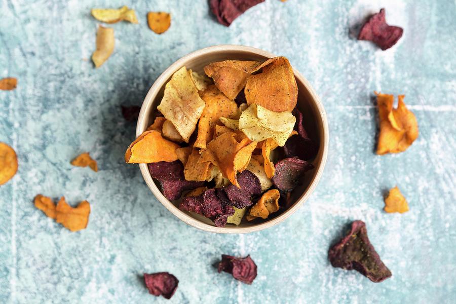 Colourful Vegetable Crisps In A Bowl #1 Photograph by Sandra Rsch