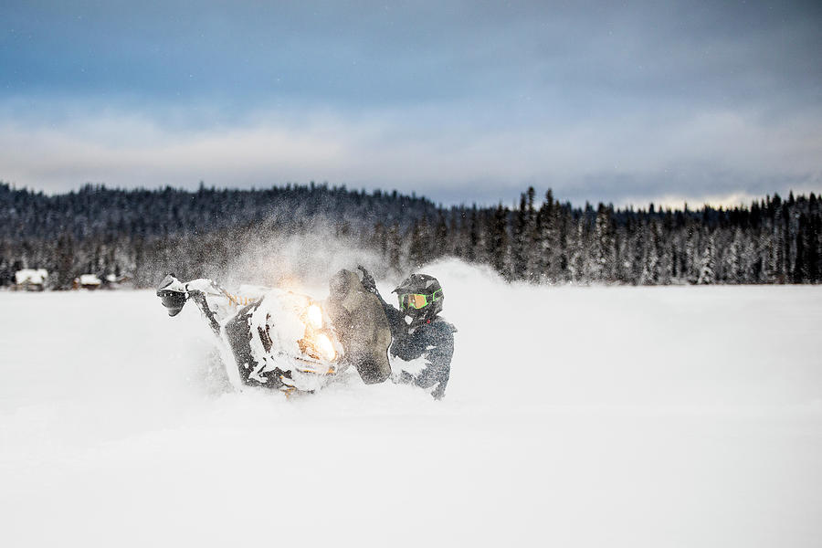 Winter Photograph - Confident And Aggressive Rider Operates Snowmobile In Deep Snow. #1 by Cavan Images