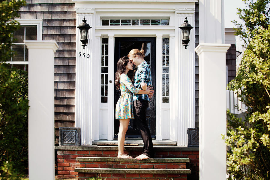 Couple Embracing While Standing On Steps At Front Stoop Photograph By Cavan Images Fine Art