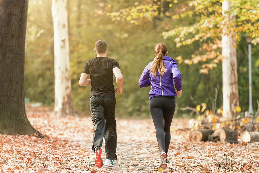 Couple Jogging #1 Photograph by Microgen Images/science Photo Library