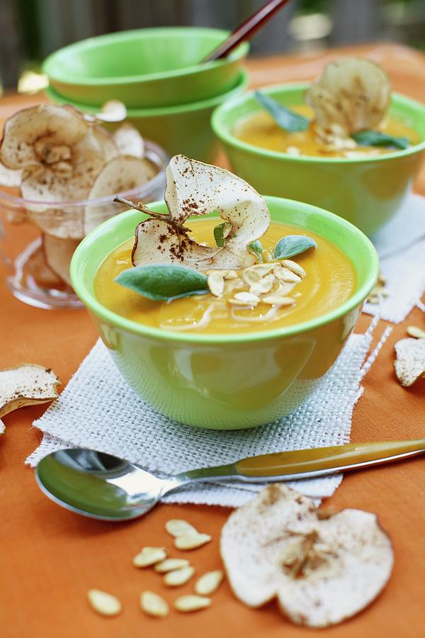 Cream Of Squash Soup With Apple Crisps And Pumpkin Seeds #1 Photograph by Strokin, Yelena