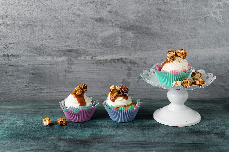 Cupcakes With Vanilla Buttercream, Caramel Sauce And Caramel Popcorn #1 Photograph by Mandy Reschke