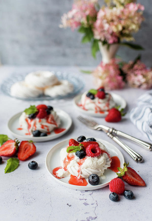 Delicious Mini Pavlova Meringue Cakes With Fresh Berries And Cream. #1 Photograph by Cavan Images / Dorene Hookey Delicious Mini Pavlova Meringue Cakes With Fresh Berries And Cream. #1 Photograph by Cavan Images / Dorene Hookey