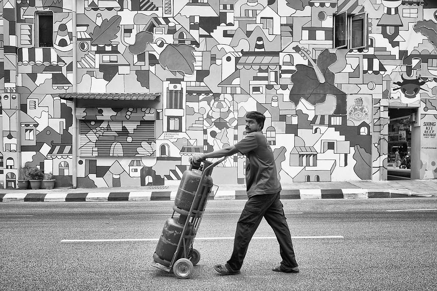 Black And White Photograph - Delivery Man #1 by Kieron Long