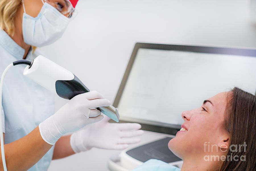 Dentist Using 3d Dental Camera For Scanning Teeth Photograph by
