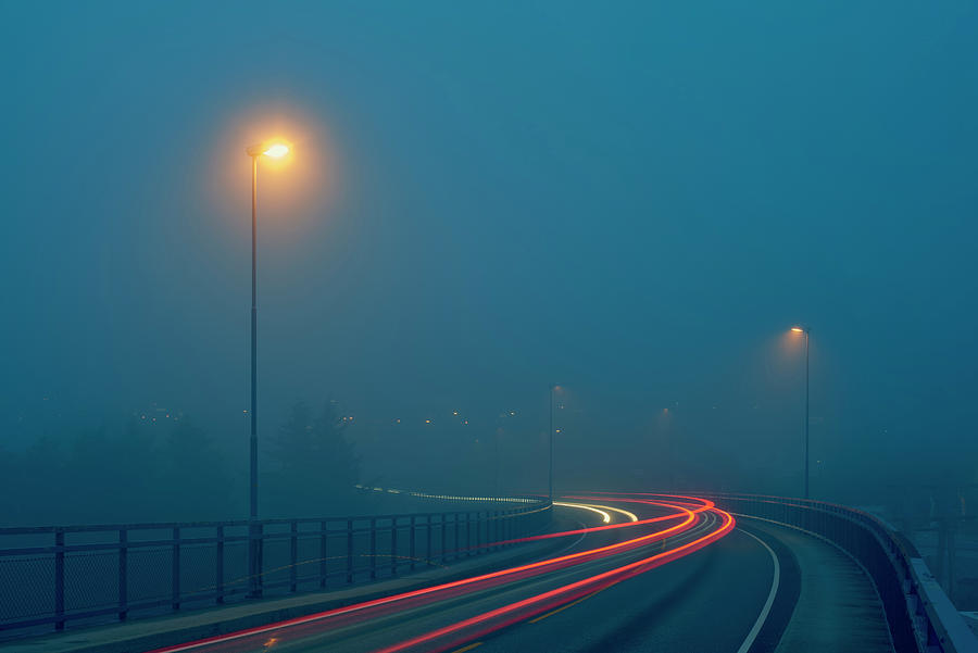 Diminishing Perspective Of Light Trails On Misty Road Illuminated By ...