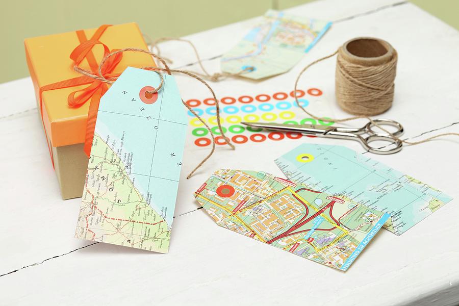Diy Gift Tags Made From Old Maps #1 Photograph by Thordis Rggeberg