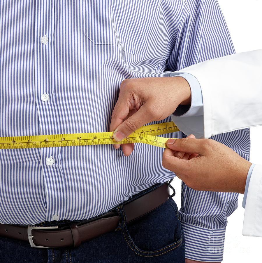 Doctor Measuring Man S Waist Photograph By Science Photo Library Pixels