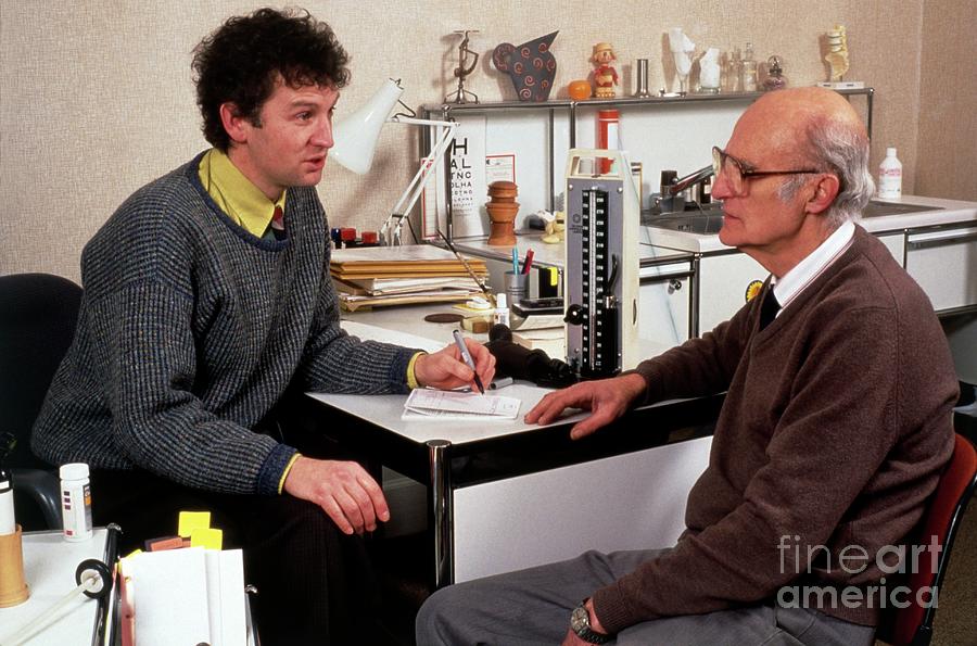 Doctor Writing A Prescription For An Elderly Man #1 Photograph by Chris Priest & Mark Clarke/science Photo Library