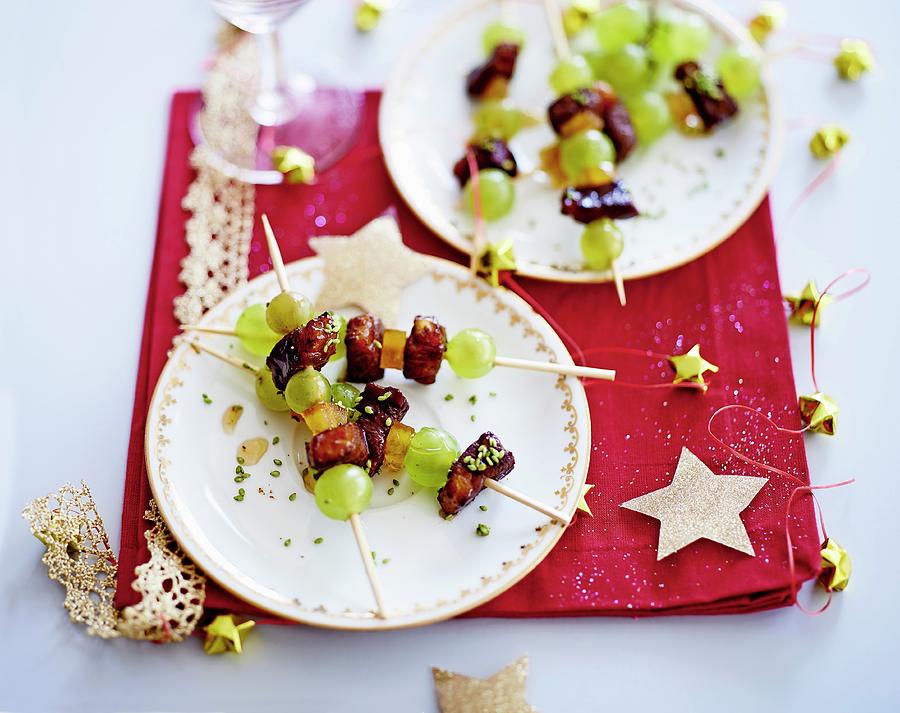 Duck In Honey And Crushed Pistachios, Candied Orange And White Grape Brochette #1 Photograph by Balme