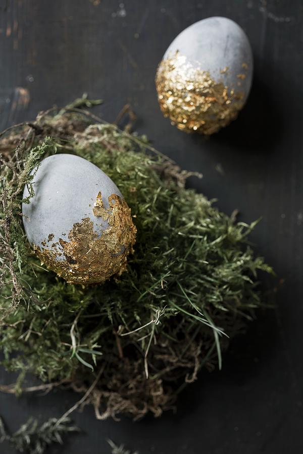 Easter Eggs Painted With Stone Effects And Gold Leaf On Moss #1 Photograph by Pia Simon