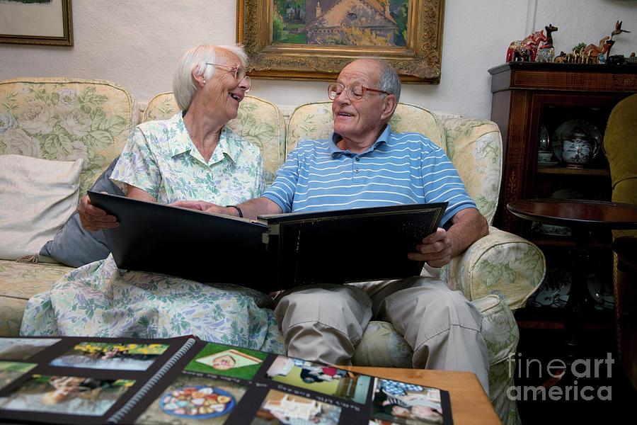 Elderly Couple Looking At Family Photos #1 Photograph by Science Photo Library Elderly Couple Looking At Family Photos #1 Photograph by Science Photo Library