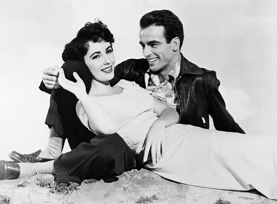 ELIZABETH TAYLOR and MONTGOMERY CLIFT in A PLACE IN THE SUN -1951-. #1 Photograph by Album