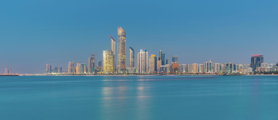 Evening View Of The Illuminated Abu Dhabi Skyline, Uae #1 Photograph by Manuel Bischof