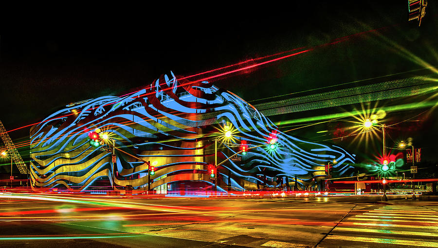 Exterior of Petersen Automotive Museum at night in november with #1 Photograph by Alex Grichenko