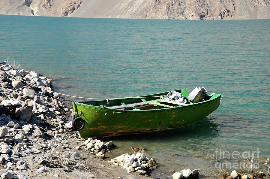 Faded green yellow motor power boat parked at Satpara Lake Pakistan #2 Photograph by Imran Ahmed