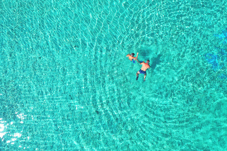 Father And Son Snorkels Photograph by Daniel Chetroni - Fine Art America