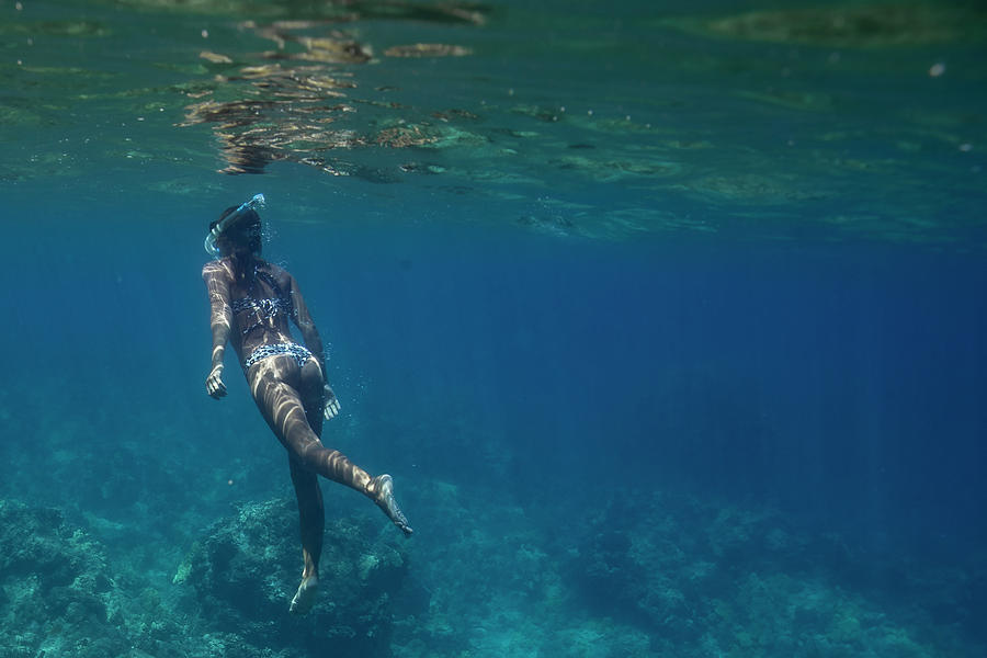 Female Swims Underwater In Blue Hawaiian Waters Photograph by Cavan ...