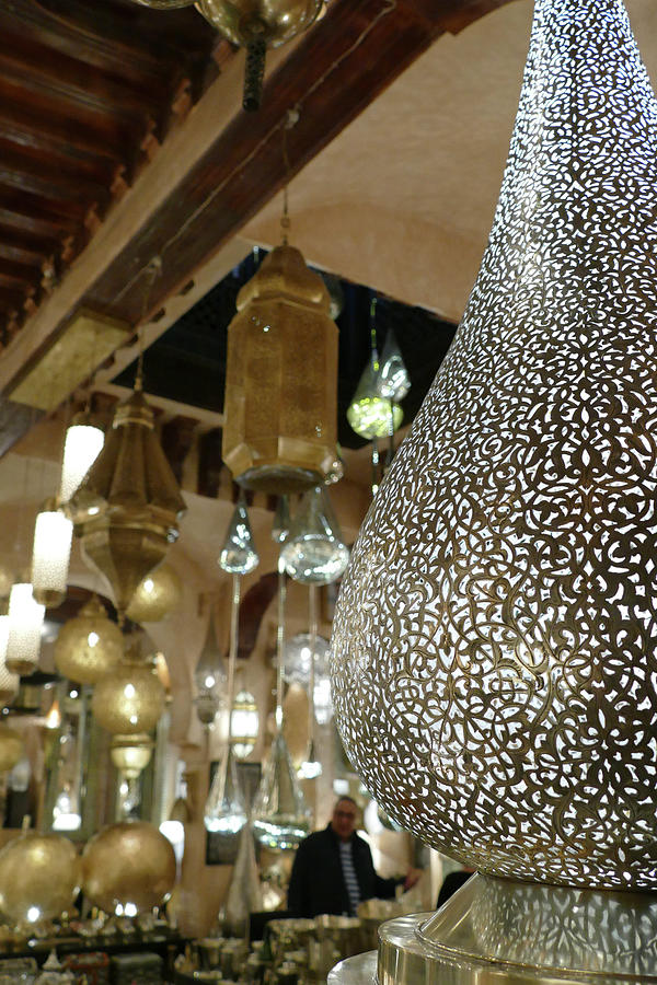 Filigree metal lamps in a shop in the medina  #1 Photograph by Steve Estvanik