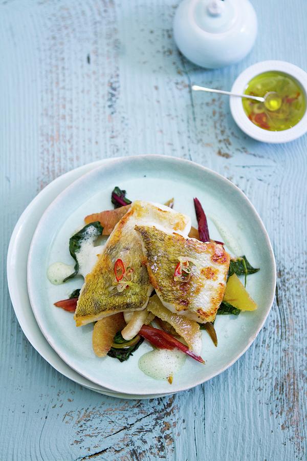Fillet Of Fish With Chard And Orange Segments #1 Photograph by Eising Studio