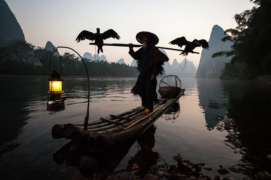Fisherman With Cormorants On Li River #1 Photograph by Matteo Colombo