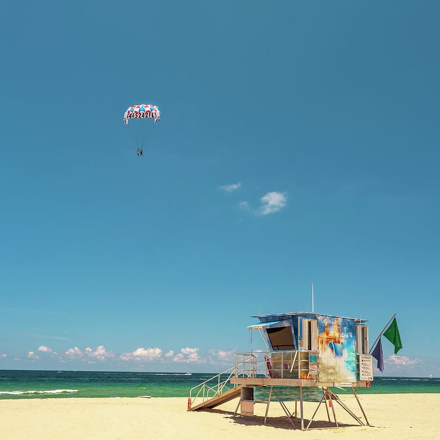 Florida, South Florida, Fort Lauderdale Beach, Lifeguard Station With Tourists Parasailing #1 Digital Art by Gabriel Jaime Jimenez