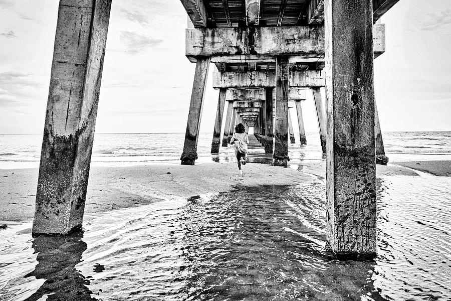 Florida, South Florida, Woman Running Under The Juno Beach Pier #1 Digital Art by Laura Diez
