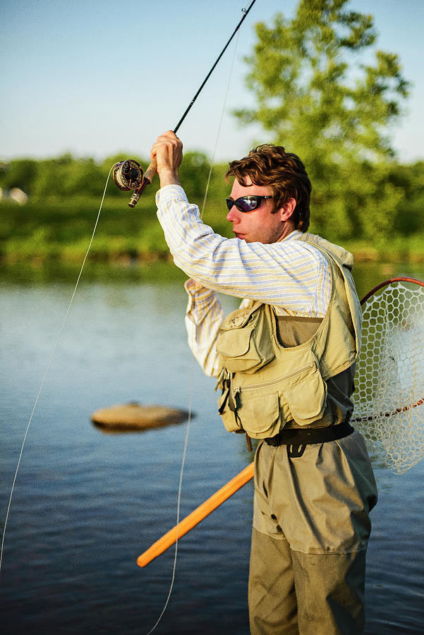 Insects Photograph - Flyfishing At Sunset On A Southeastern River #1 by Cavan Images