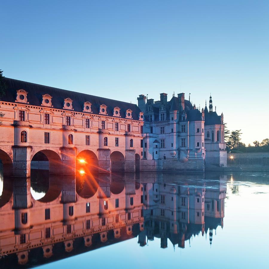 France, Centre, Loire Valley, Indre-et-loire, Chenonceaux, Chenonceau Castle, The Chateau On The River Cher Illuminated At Sunset #1 Digital Art by Luigi Vaccarella