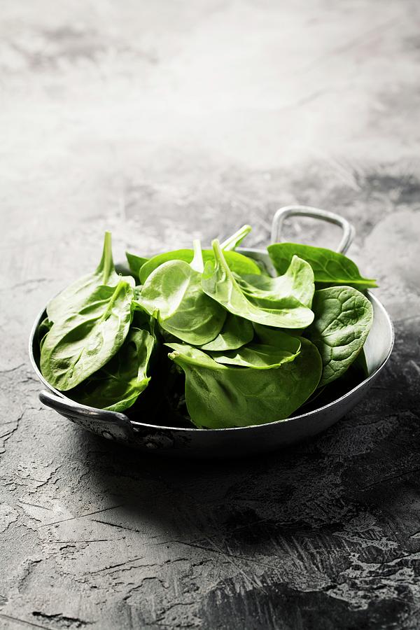 Fresh Green Spinach On Rustic Background #1 Photograph by Natalia Klenova
