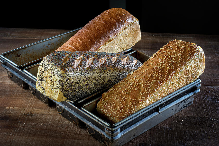 Freshly Baked, Light, Seeded Loaves In A Baking Tin #1 Photograph by Lode Greven Photography