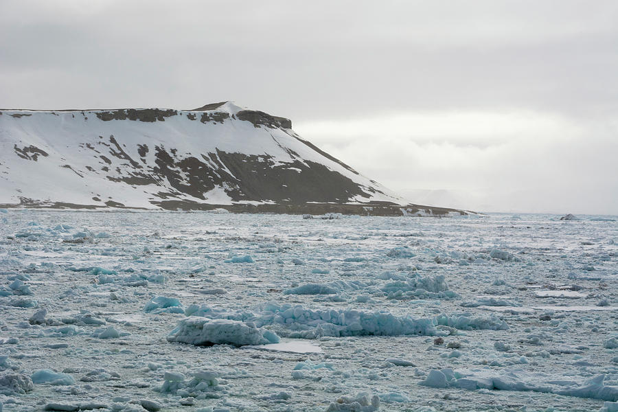 Frozen Landscape And Distant Snow Capped Mountain, Wahlenberg Fjord ...