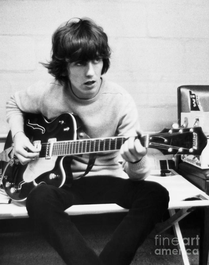 George Harrison Photograph - George Harrison Playing Guitar #1 by Bettmann