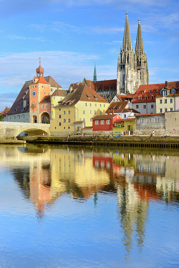 Germany, Bavaria, Bayern, Upper Palatinate, Danube, Regensburg Cathedral, The Stone Bridge, St. Peters Church And The Old Town Of Regensburg Reflecting On The Danube River #1 Digital Art by Francesco Carovillano