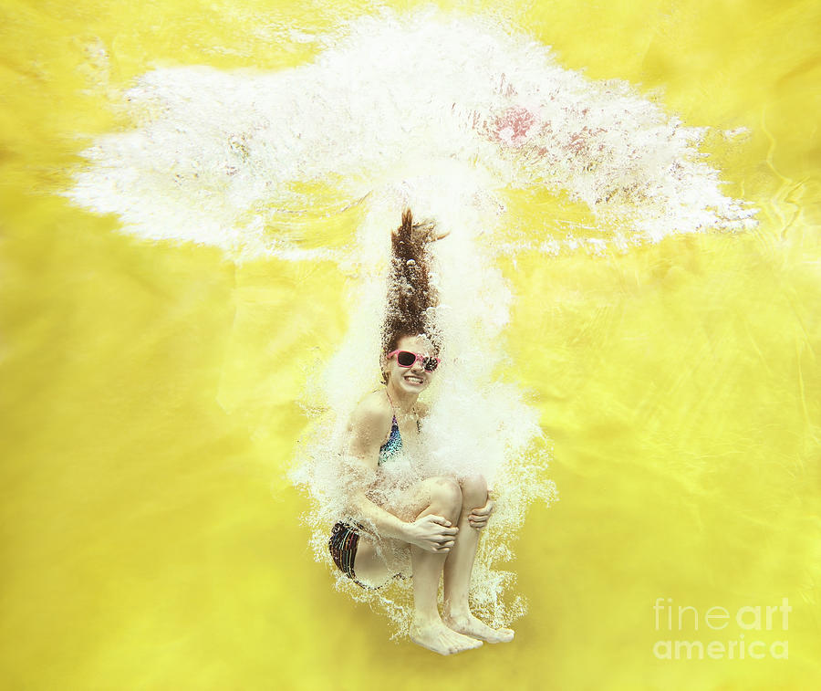 Girl Jumping Into Water On Yellow #1 Photograph by Stanislaw Pytel