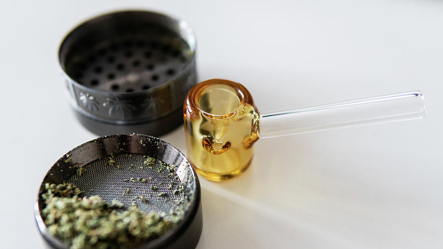 Glass Smoking Pipe And Marijuana Buds Close-up. Photograph by