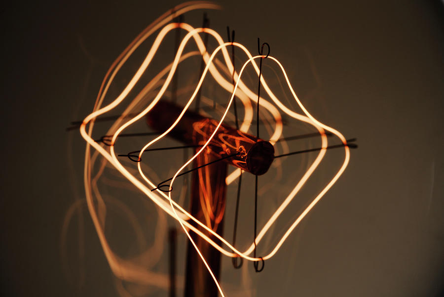 Glowing Lightbulb Filament #1 Photograph by GIPhotoStock Images