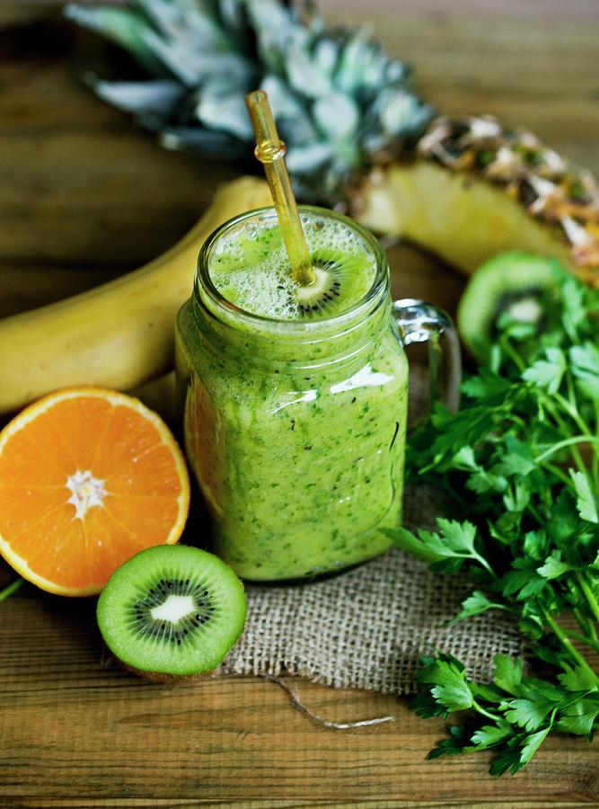 Green Fruit Smoothie With Kiwi And Parsley #1 Photograph by Dorota Indycka